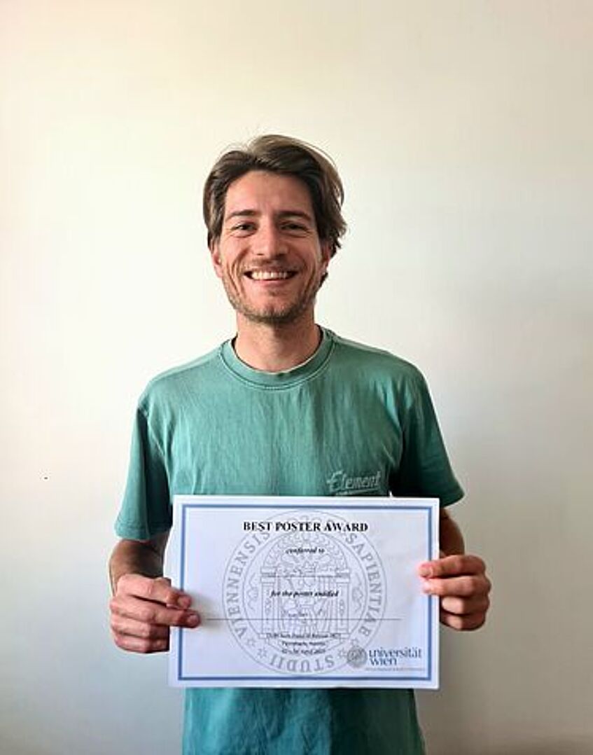 Tobias Pointner mit seiner PosterAward Bestätigung
